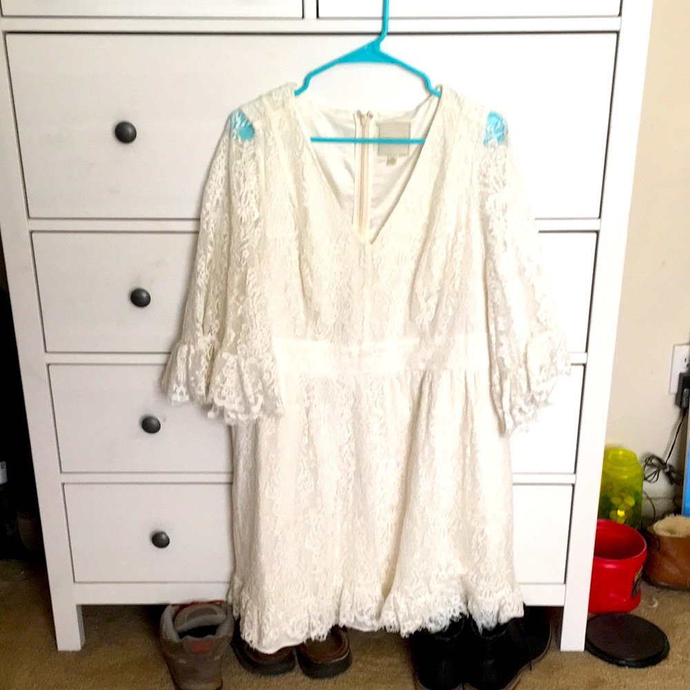 Lacy white/cream knee length bridal dress